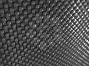 Royalty Free Clipart Image of Abstract Carbon Fiber With Pimples