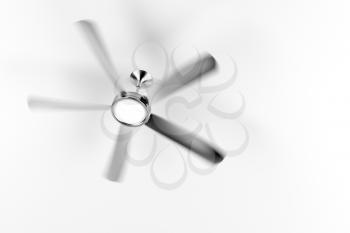 Spinning ceiling fan in the room