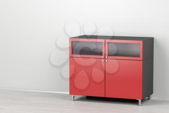 Modern red cabinet in the room