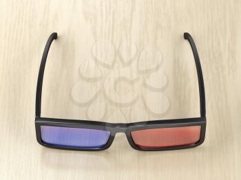 3D glasses on wood background