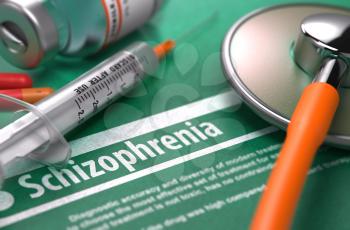 Diagnosis - Schizophrenia. Medical Concept with Blurred Text, Stethoscope, Pills and Syringe on Green Background. Selective Focus. 3D Render.