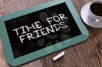 Time for Friends - Blue Chalkboard with Hand Drawn Text and White Cup of Coffee on Wooden Table. Top View. 3D Render.