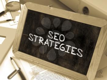 Hand Drawn SEO - Search Engine Optimization - Strategies Concept  on Chalkboard. Blurred Background. Toned Image. 3D Render.