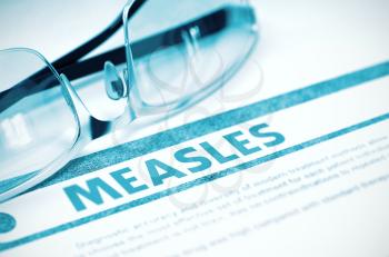 Diagnosis - Measles. Medicine Concept on Blue Background with Blurred Text and Pair of Spectacles. Selective Focus. 3D Rendering.