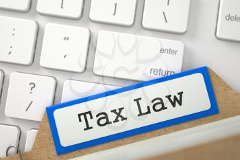 Tax Law. Orange Folder Register on Background of Modern Laptop Keyboard. Business Concept. Closeup View. Blurred Illustration. 3D Rendering.