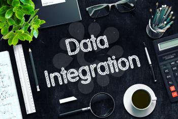 Data Integration. Business Concept Handwritten on Black Chalkboard. Top View Composition with Chalkboard and Office Supplies. 3d Rendering. Toned Image.