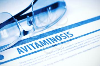 Avitaminosis - Printed Diagnosis with Blurred Text on Blue Background with Eyeglasses. Medicine Concept. 3D Rendering.