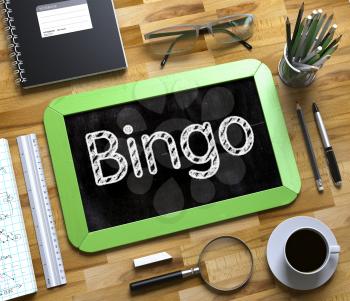 Top View of Office Desk with Stationery and Green Small Chalkboard with Business Concept - Bingo. Bingo - Text on Small Chalkboard.3d Rendering.