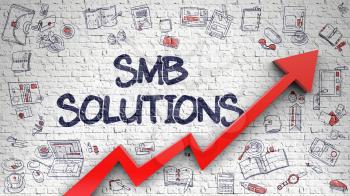 SMB Solutions - Modern Style Illustration with Doodle Elements. SMB Solutions - Development Concept. Inscription on White Brickwall with Doodle Design Icons Around. 