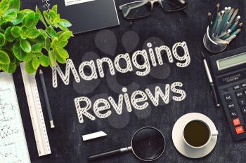 Managing Reviews Handwritten on Black Chalkboard. 3d Rendering. Toned Illustration.
