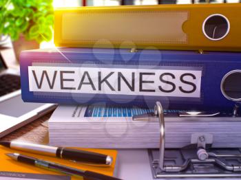 Weakness - Blue Office Folder on Background of Working Table with Stationery and Laptop. Weakness Business Concept on Blurred Background. Weakness Toned Image. 3D.