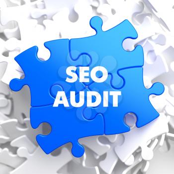 SEO Audit on Blue Puzzle on White Background.