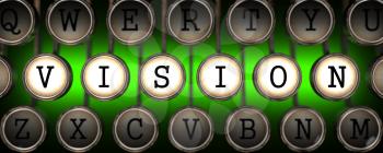 Vision on Old Typewriter's Keys on Green Background.