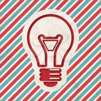 Light Bulb Icon on Red and Blue Striped Background. Vintage Concept in Flat Design.
