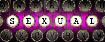 Sexual on Old Typewriter's Keys on Pink Glamor Background.
