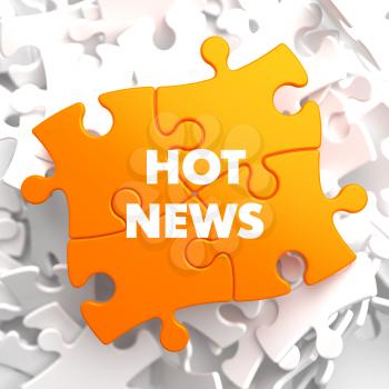 Hot News on Orange Puzzle on White Background.