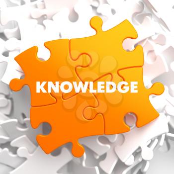 Knowledge on Orange Puzzle on White Background.