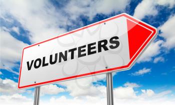 Volunteers - Inscription on Red Road Sign on Sky Background.