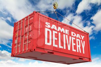 Same Day Delivery - Red Hanging Cargo Container on Sky Background.