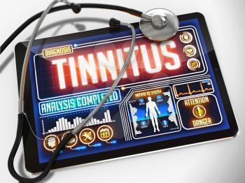Tinnitus - Diagnosis on the Display of Medical Tablet and a Black Stethoscope on White Background.
