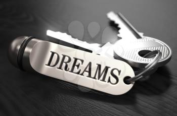 Keys to Dreams - Concept on Golden Keychain over Black Wooden Background. Closeup View, Selective Focus, 3D Render. Black and White Image.