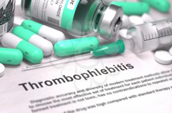 Thrombophlebitis - Printed Diagnosis with Blurred Text. On Background of Medicaments Composition - Mint Green Pills, Injections and Syringe.