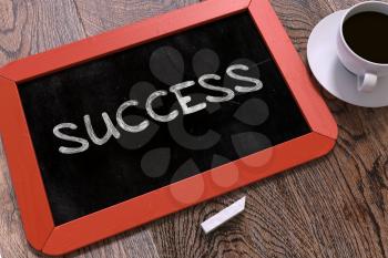 Success Handwritten on Red Chalkboard. Business Concept. Composition with Chalkboard and Cup of Coffee. Top View Image.