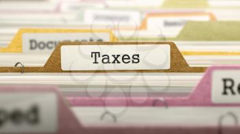 Taxes Concept on File Label in Multicolor Card Index. Closeup View. Selective Focus. 