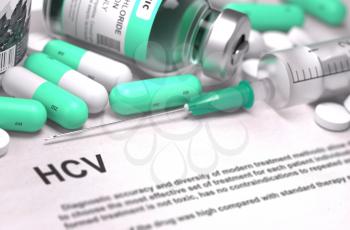 HCV - Hepatitis C Virus - Printed Diagnosis with Mint Green Pills, Injections and Syringe. Medical Concept with Selective Focus.