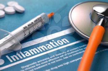 Inflammation - Printed Diagnosis on Blue Background and Medical Composition - Stethoscope, Pills and Syringe. Medical Concept. Blurred Image.