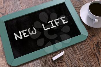 New Life Concept Hand Drawn on Blue Chalkboard on Wooden Table. Business Background. Top View.