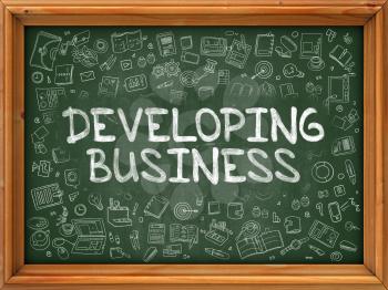 Green Chalkboard with Hand Drawn Developing Business with Doodle Icons Around. Line Style Illustration.