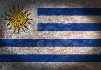 Old rusty metal sign with a flag - Uruguay