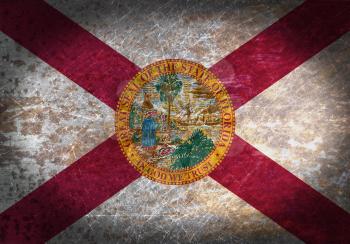 Old rusty metal sign with a flag - Florida