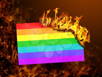 Flag burning - concept of war or crisis - Rainbow flag