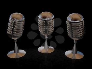 3 metal microphones on a black background