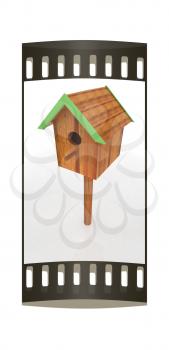 Nest box birdhouse on a white background. The film strip