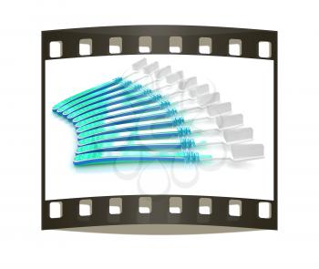 Toothbrushes on a white background. The film strip