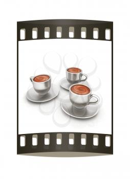 Coffee cups on saucer on a white background. The film strip