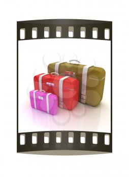 Traveler's suitcases. Family travel concept. The film strip