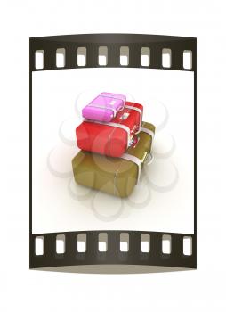 Traveler's suitcases. Family travel concept. The film strip