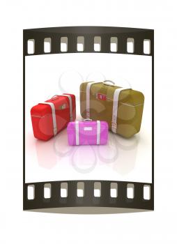 Traveler's suitcases. Family travel concept. The film strip