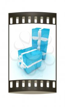 Bright christmas gifts on a white background. The film strip 