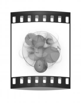 Citrus and apples on a white background. The film strip