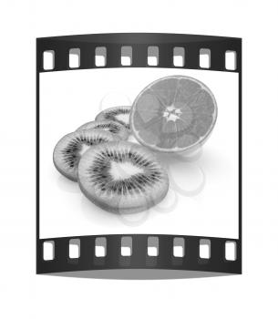 slices of kiwi and half orange on a white. The film strip