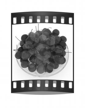 Sweet cherries on a plate on a white background. The film strip