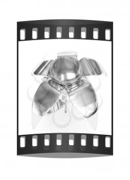 Chrome flower with a gold head on a white background. The film strip