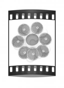 half oranges and oranges on a white background. The film strip