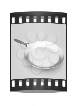 Pan with handle on light gray background. The film strip