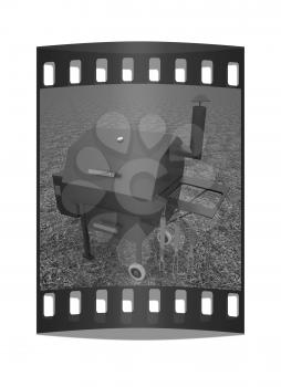 oven barbecue grill on the green grass. The film strip